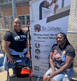 Two women smile at an outdoor event beside a banner for The Collective: Black Girls Mental Health Collective, listing therapy, support groups, wellness, and education services.